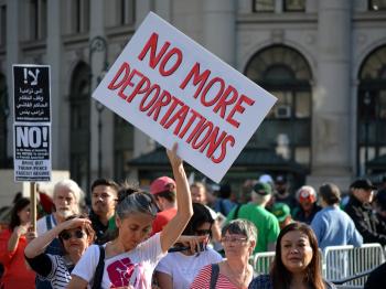 No More Deportations protest sign 