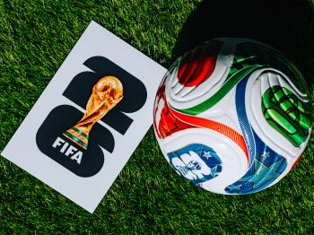 Soccer ball next to FIFA 2026 image of World Cup